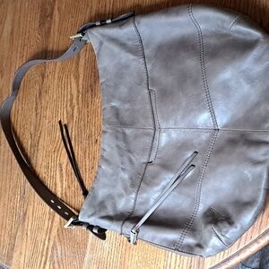 Hobo purse, grey in color.